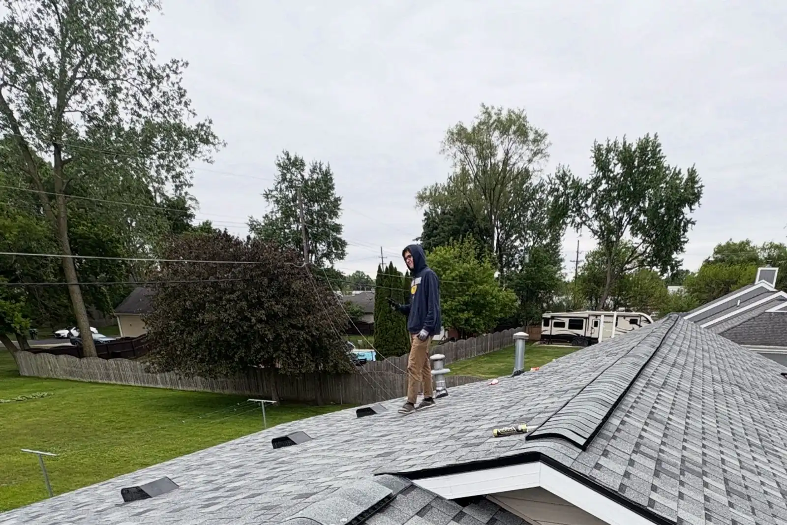A finished grey architectural shingle roof with clean valleys and hips.